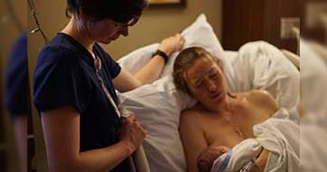 Danielle Breastfeeding in Hospital Bed